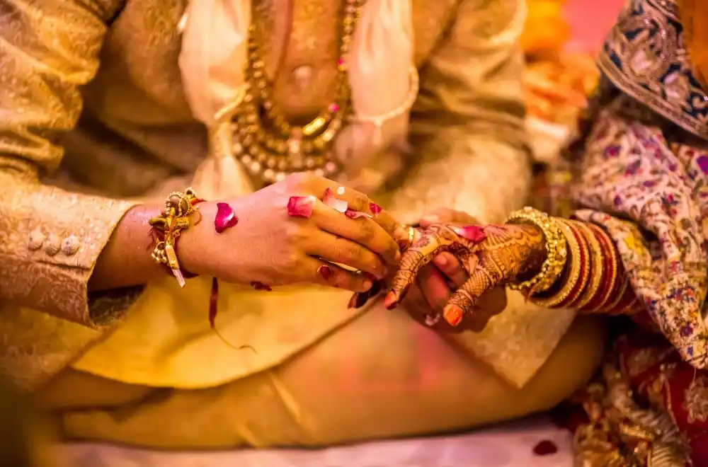 A vibrant Indian wedding ceremony, showcasing traditional attire, decorations, and joyful celebrations among guests.