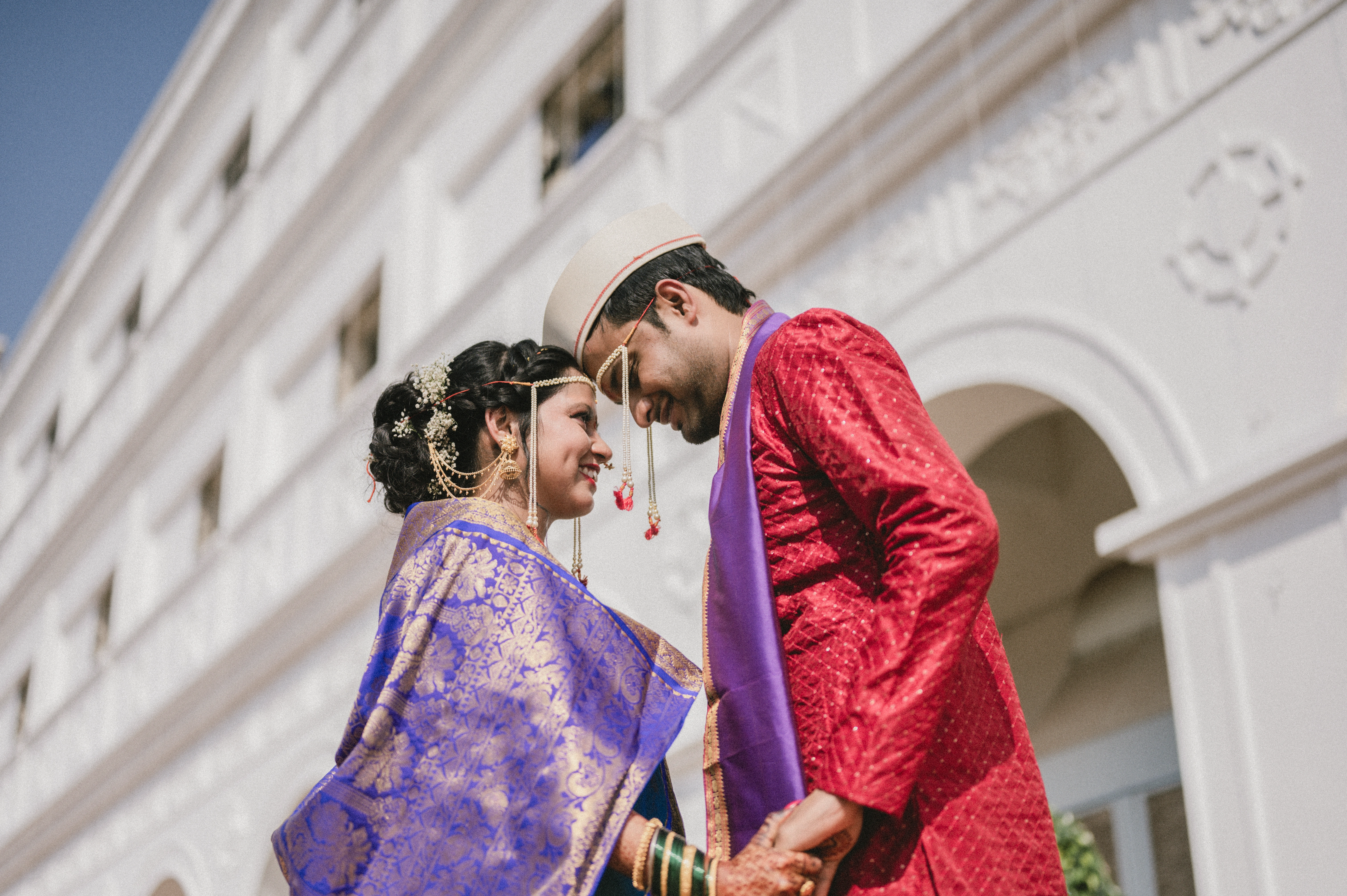 An elegant Indian wedding ceremony, featuring colorful decorations, traditional attire, and a joyful atmosphere.